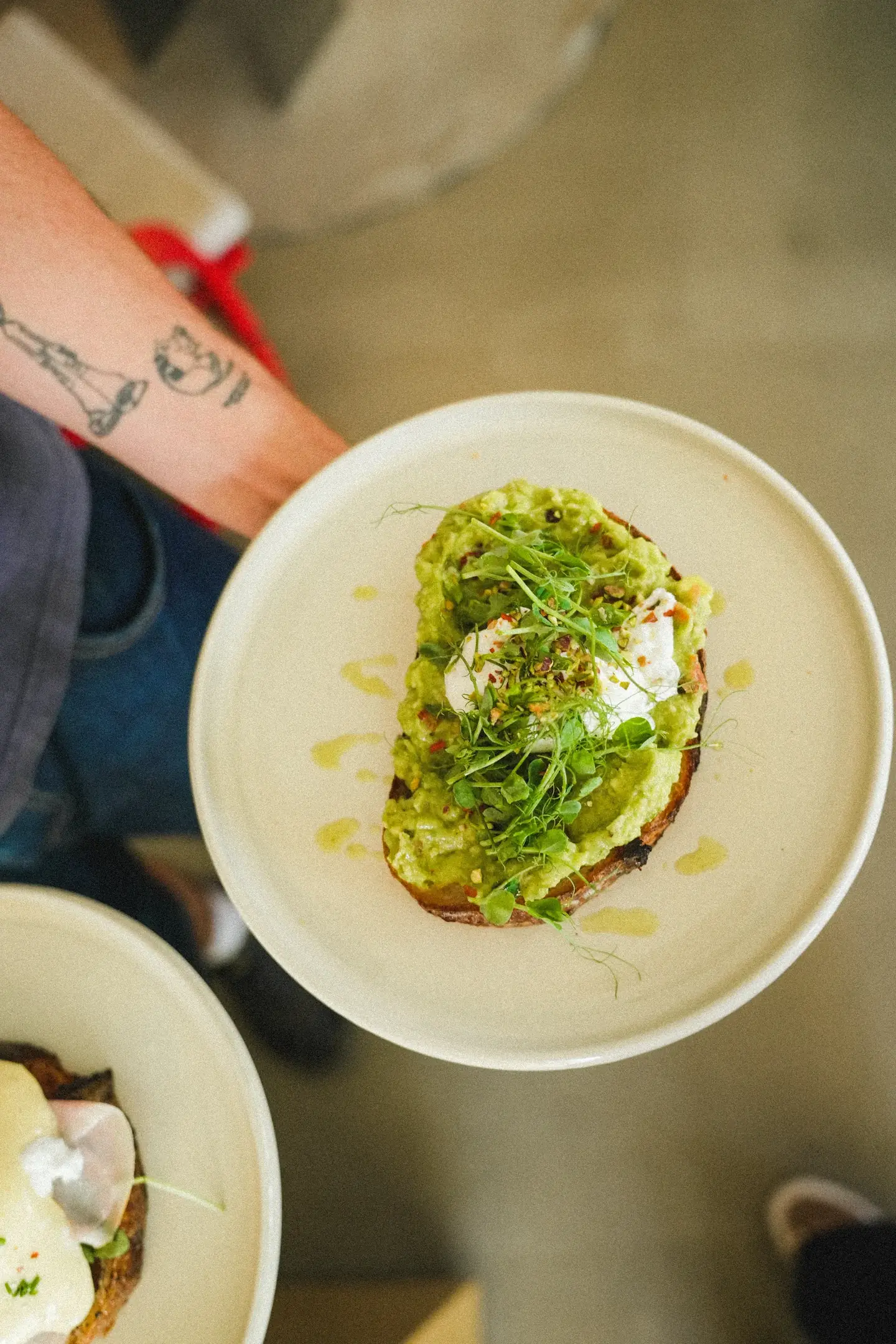 Avocado toast with egg and pea shoots